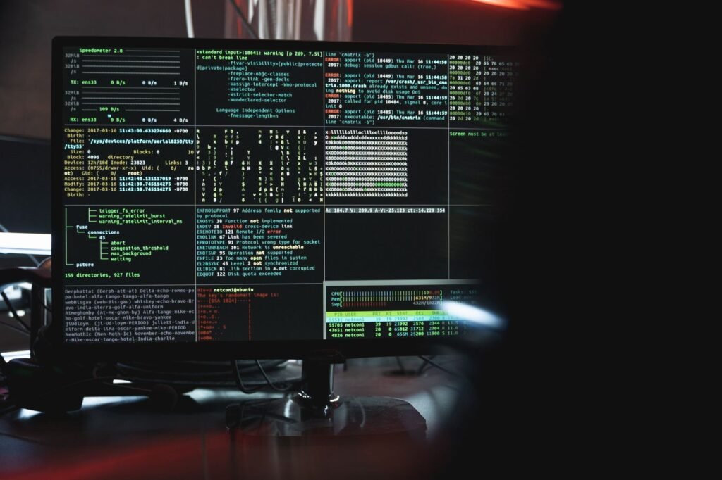 Close-up of a monitor showing security information and programming text