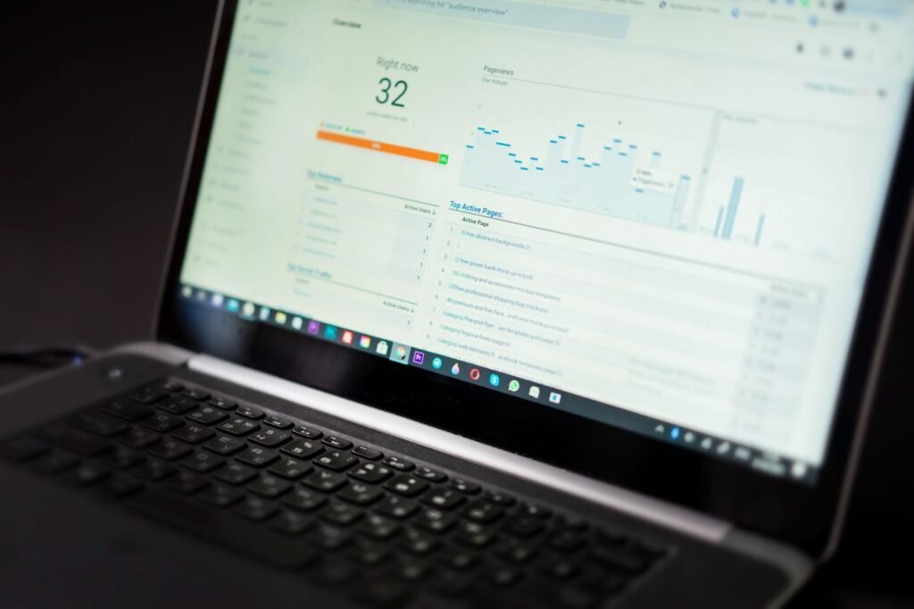 Laptop showing a website analytics dashboard with charts