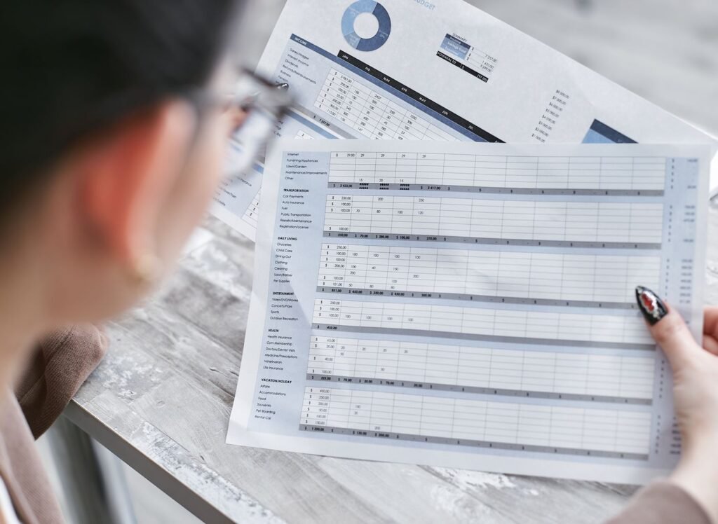 Businesswoman reviewing spreadsheets and charts in an office