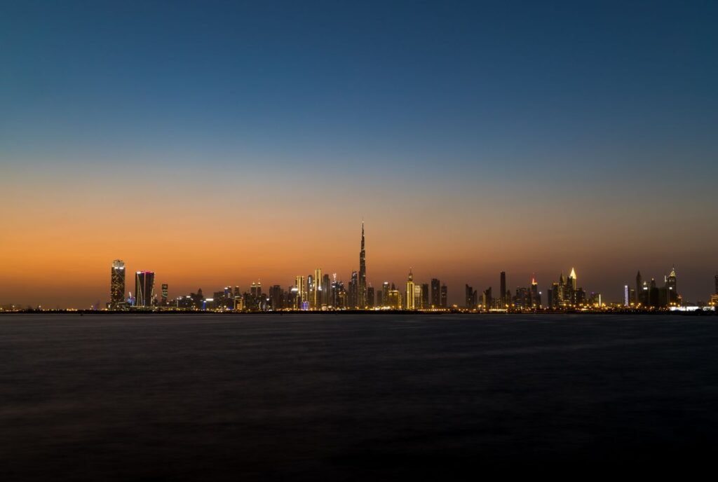 Dubai skyline with the Burj Khalifa across the water at dusk