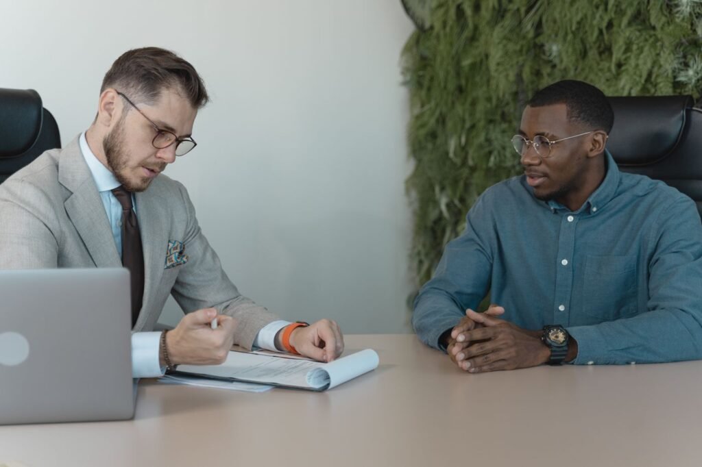 Interviewer reading a candidate's resume in an office