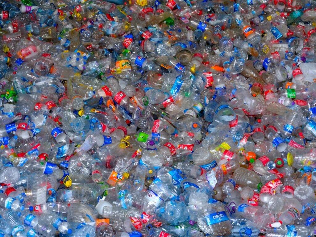 Heap of discarded plastic bottles at a recycling centre