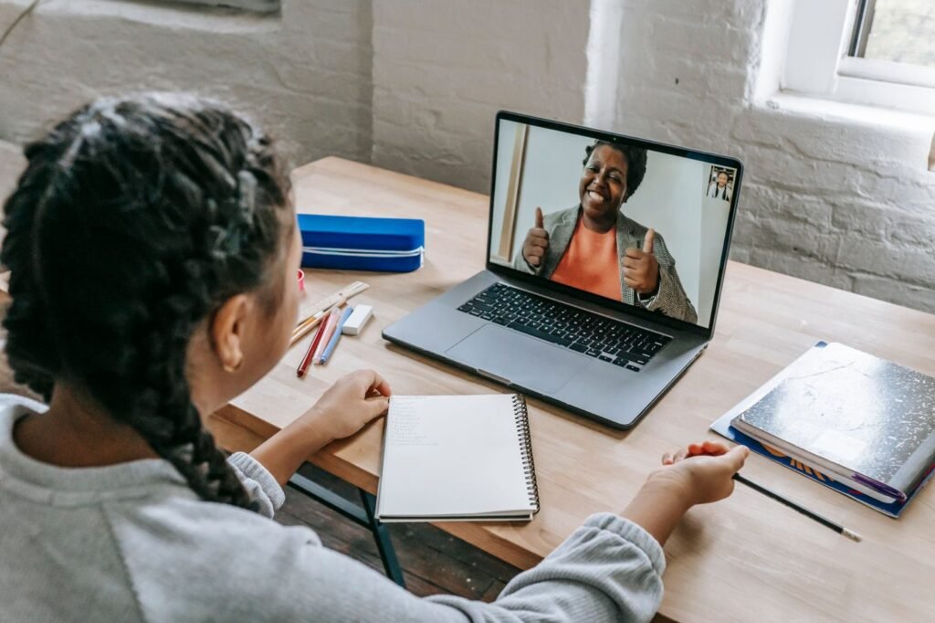 Young student on a video call with a teacher for an online lesson