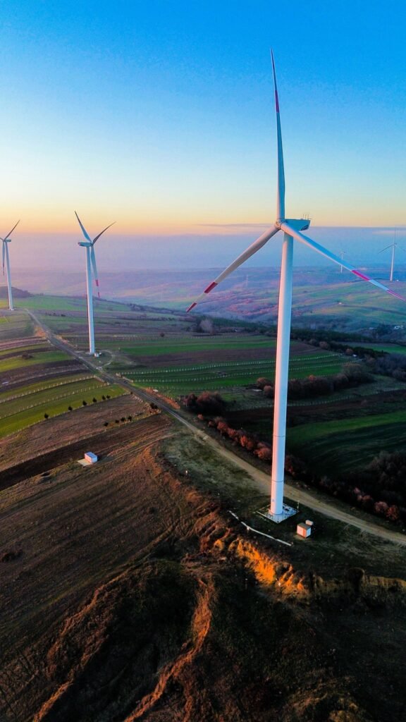 Aerial view of wind turbines at sunset
