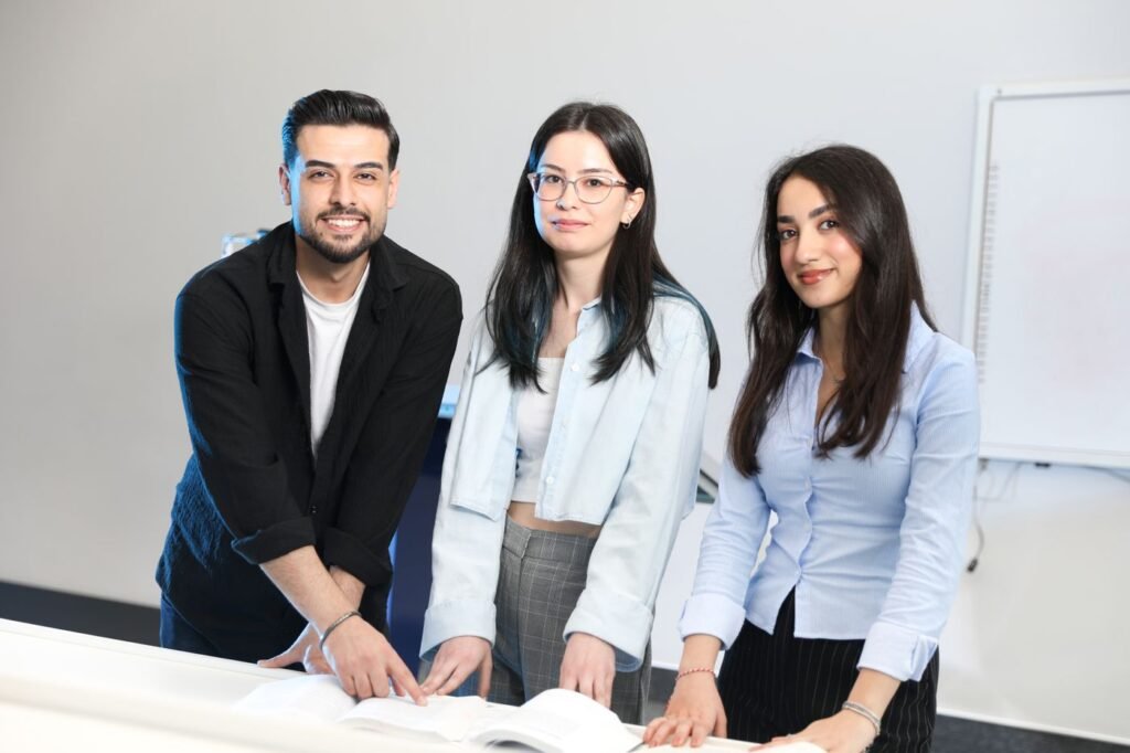 Young professionals working together at a desk in an office