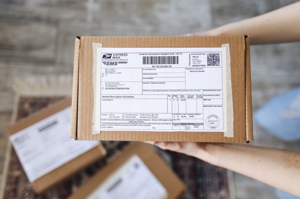 Brown delivery box with a mailing label and address details