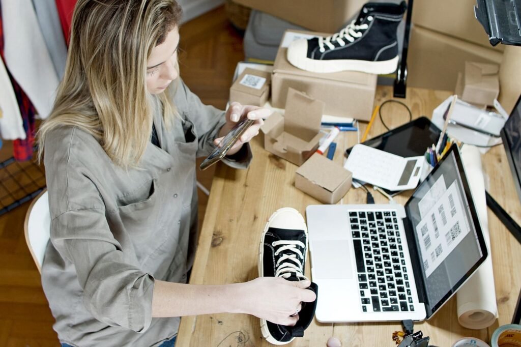 Woman photographing a product on a table for an online shop